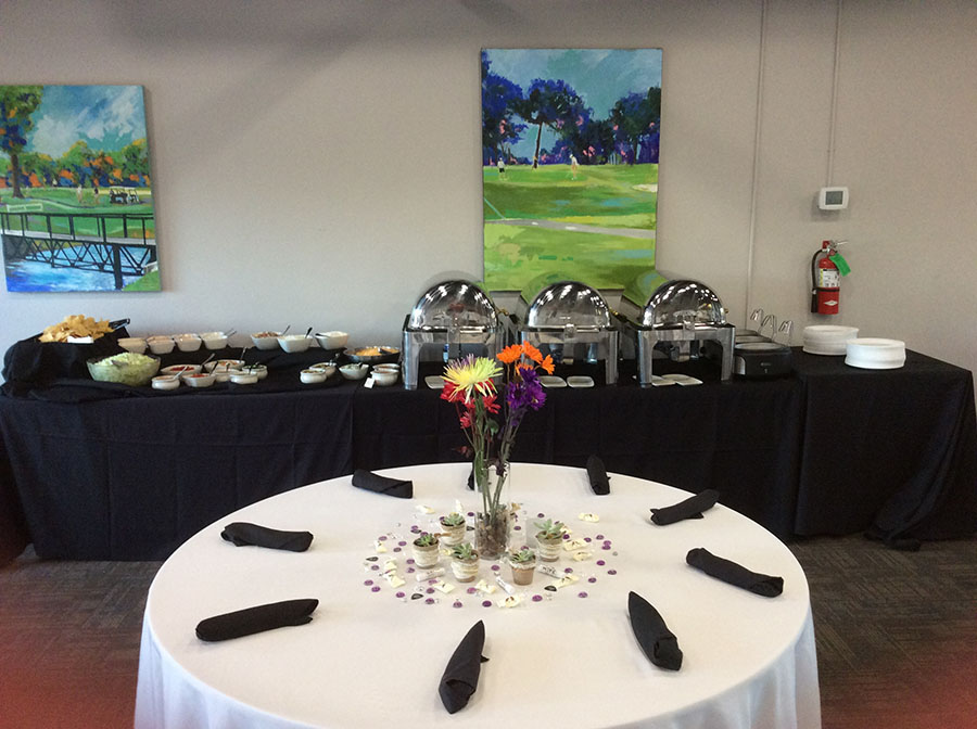 Table dressed for events with catering in the background